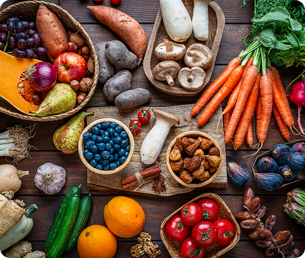 Variety of produce on wooden table.