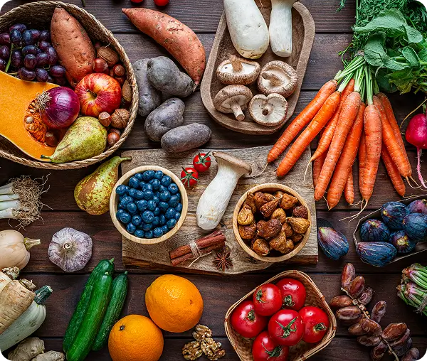 Variety of produce on wooden table.