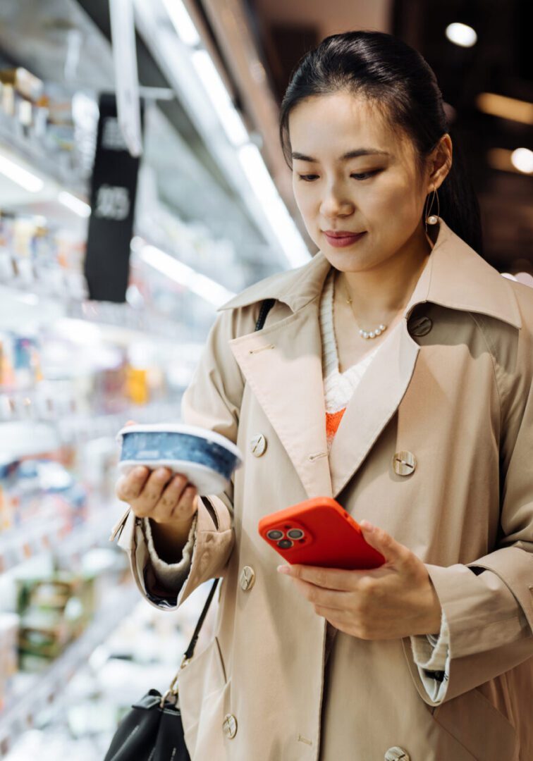 Woman shopping in grocery store aisle