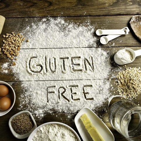 Flour with gluten-free message and baking items